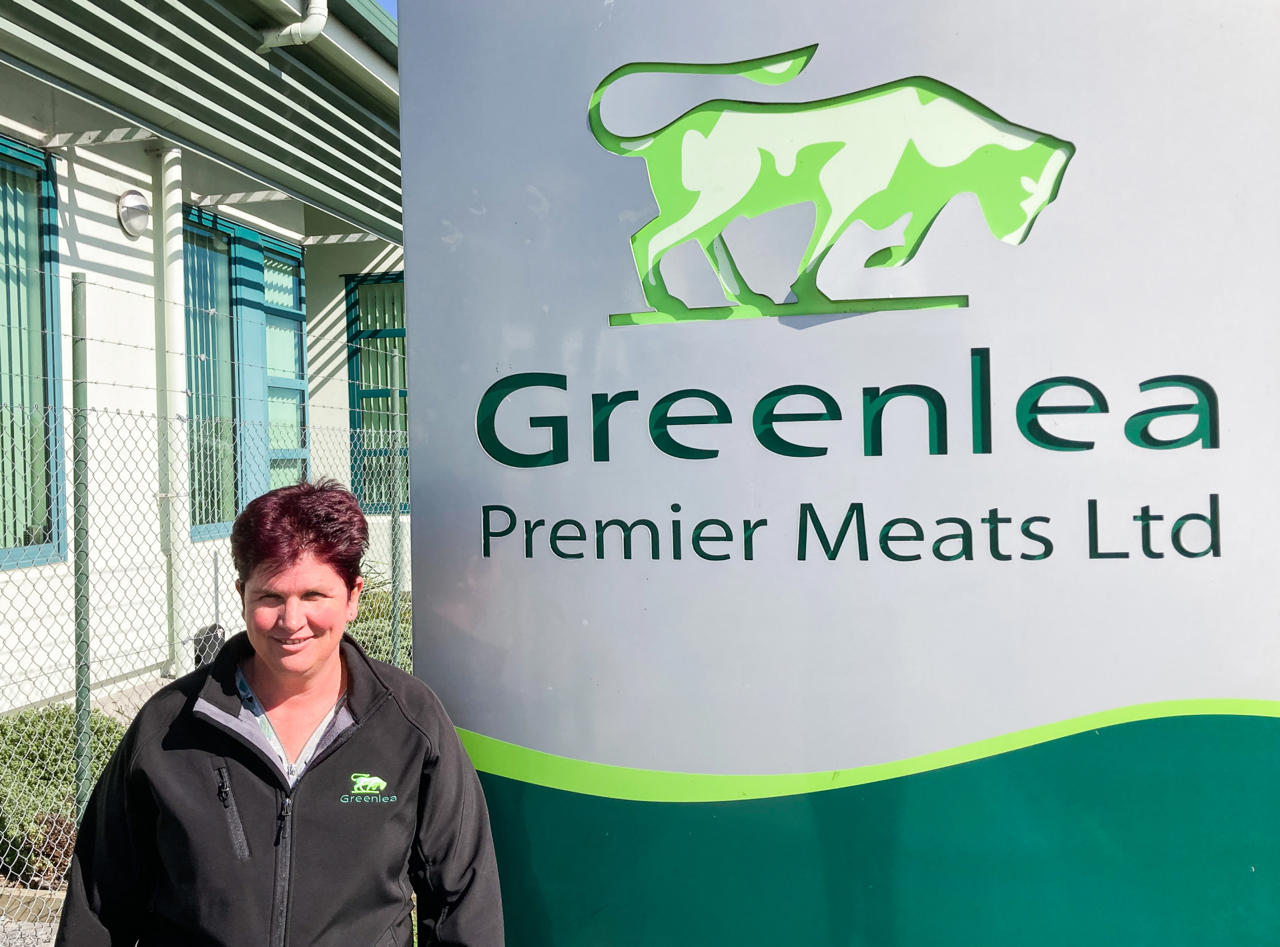 KATHRYN HAAMI in front of Greenlea sign